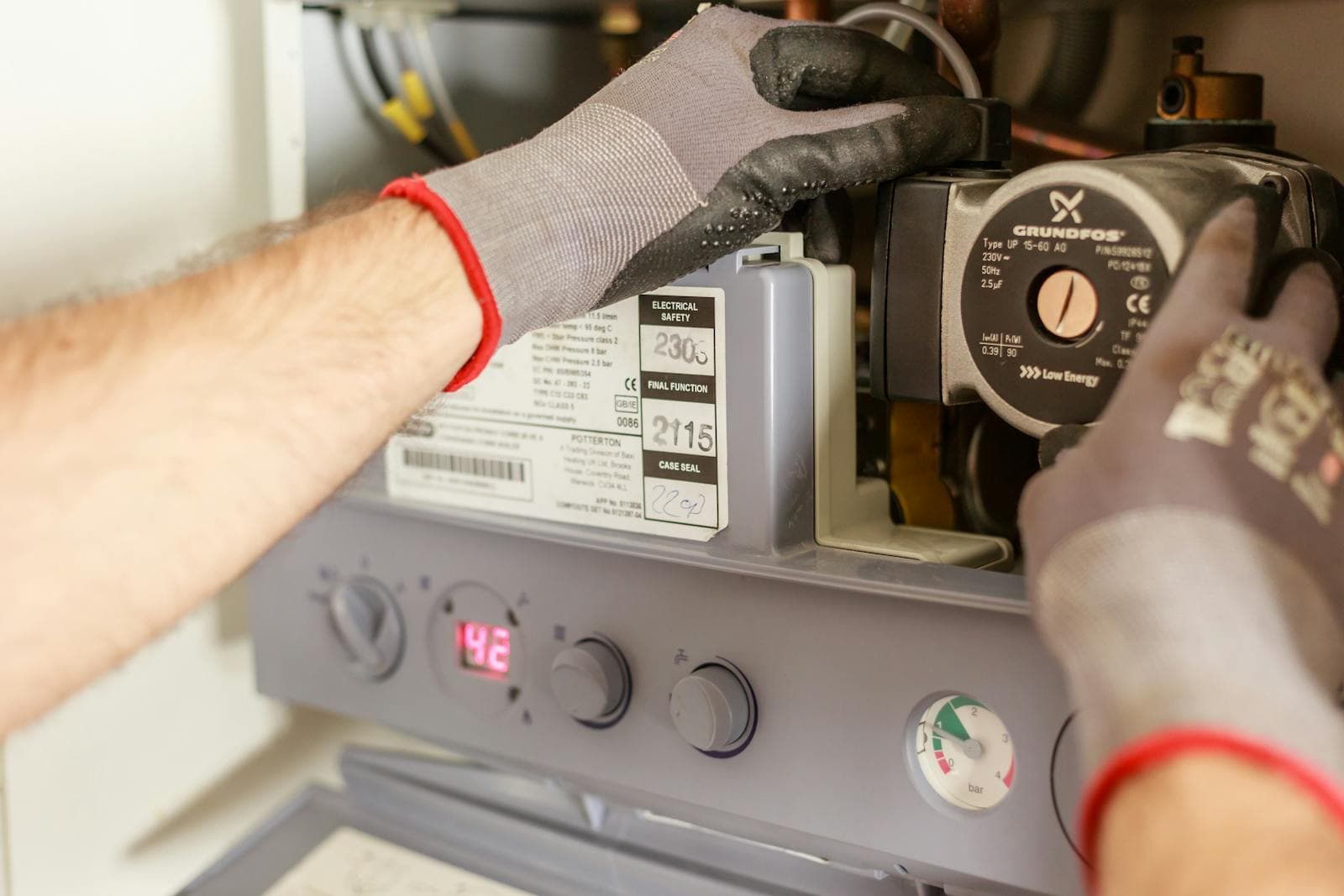Technician working on heating controls
